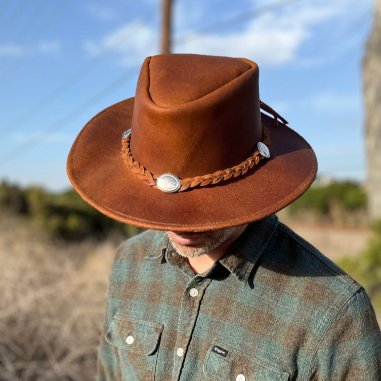 Distressed leather cowboy hat with concho band