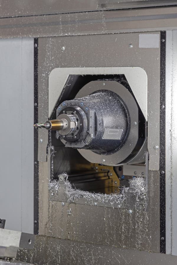 Machinery template hero — CNC spindle with metal shavings
